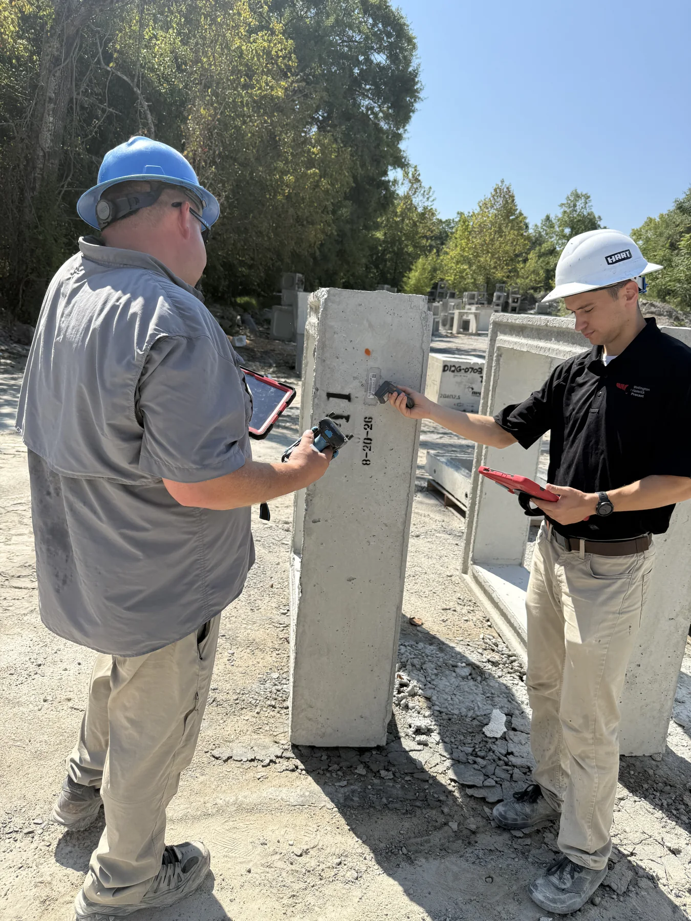 Using the Android DOT inspection app beside a precast concrete product in the yard
